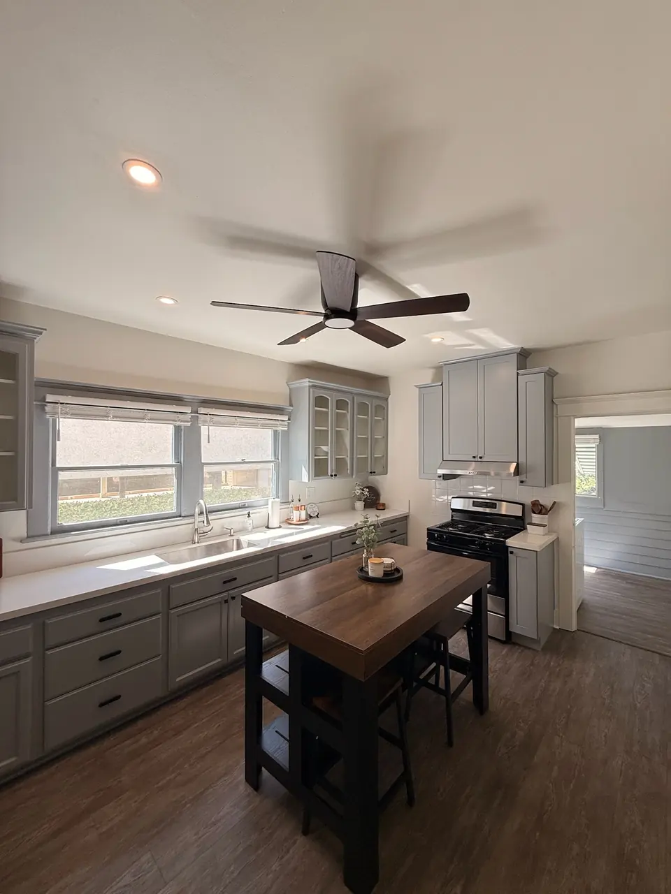 Kitchen with gray cabinets and a butcher-block island